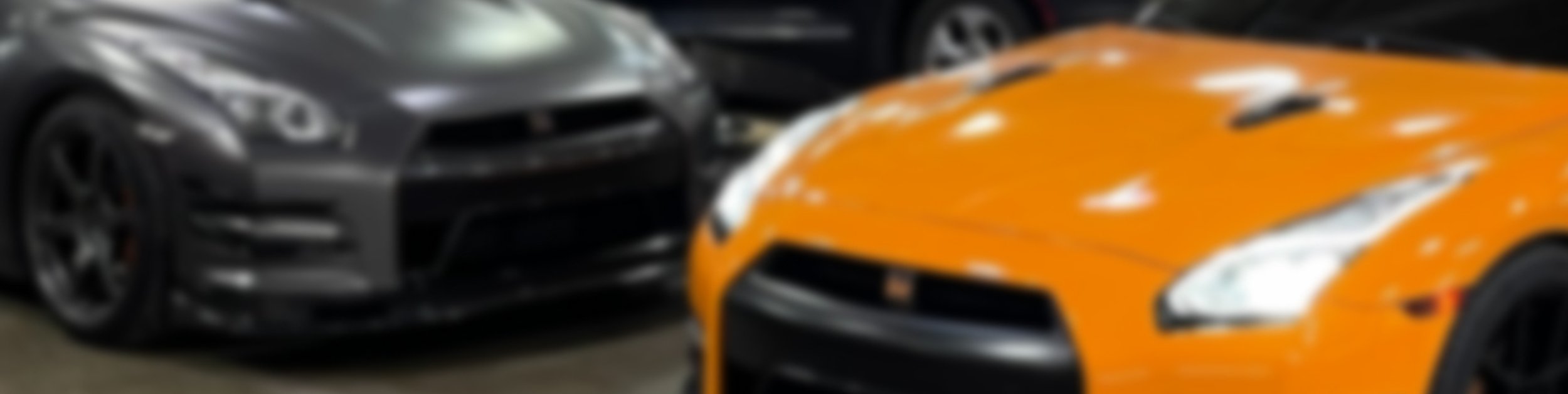 customer vehicles in the bays at Tizzano Automotive in Plain City, OH