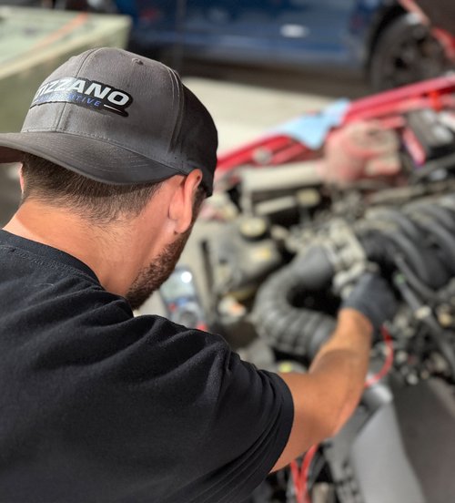Nick Tizzano working under the hood at Tizzano Automotive in Plain City, OH