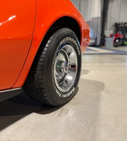 whitewall tire mounted on a chrome wheel at Tizzano Automotive in Plain City, OH